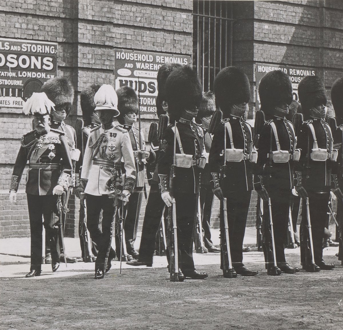 King George V inspecting the Grenadier Guards with King Faisal I of Iraq during his state visit in 1933. (Royal Collection Trust)