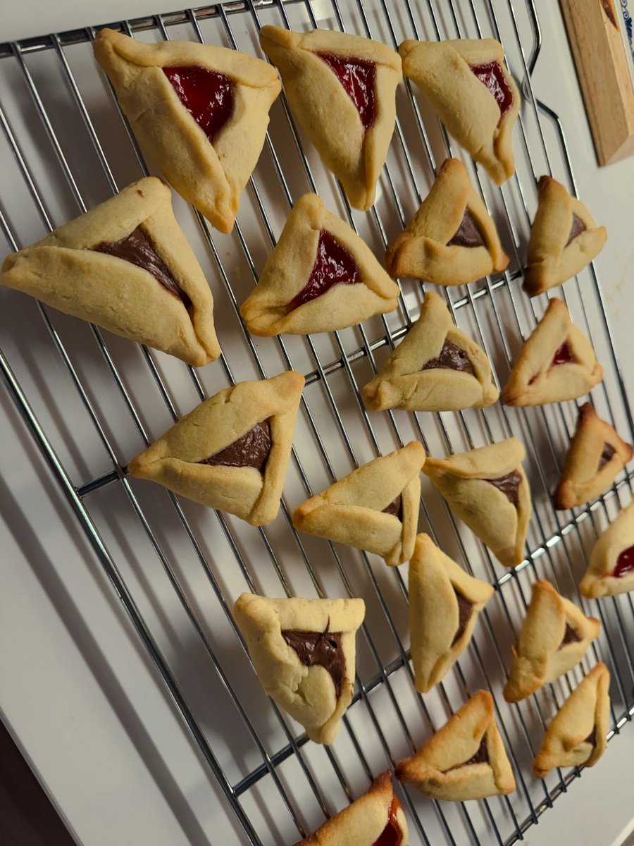 Strawberry and Hazelnut Chocolate Hamantaschen with almond extract &amp; orange zest. One day I will catch up to kindergarteners and learn to create proper triangles. 😂