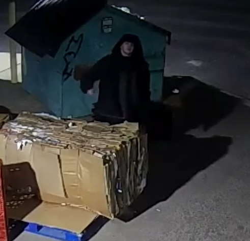 PoliceGap's tweet photo. Detective Jimenez is investigating an arson that happened in the early morning hours on 03/03/2026 in the 1400 block of S 14th St.  Attached photos are those of the suspect, seen in the shadows of a surveillance camera, setting cardboard on fire. The fire damaged part of the building. Estimates of the damage are not known yet.  Suspect is male, wearing white shoes, black pants, and a black puffy jacket.  If you have information on the identity of this person, please call 509-248-0430 or send your tip to Crime Stoppers at 1-800-222-(8477) or https://t.co/vPu7mx1Umm. 26U000835