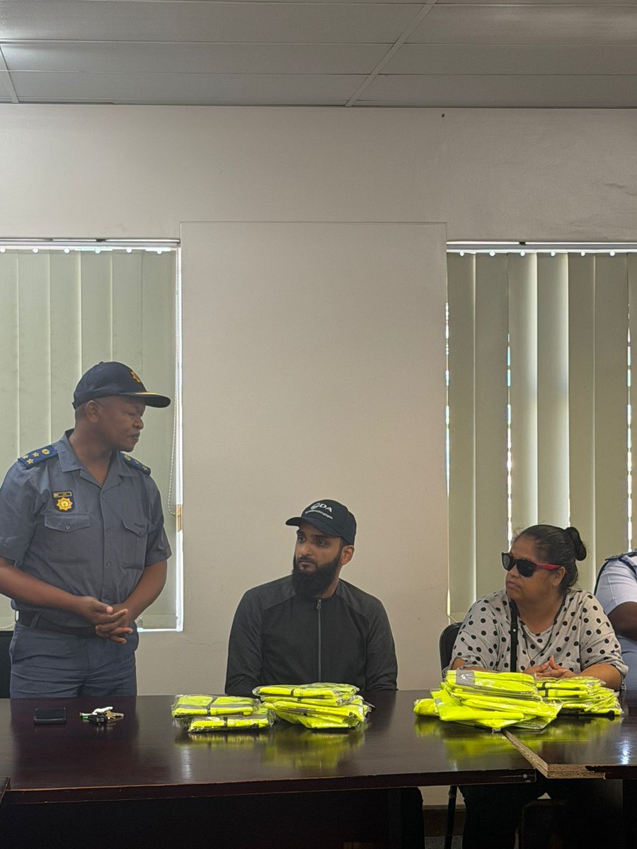 SAPoliceService's tweet photo. #sapsEC [SAPS BETHELSDORP SUPPORTS COMMUNITY IN BLUE PATROLLERS WITH REFLECTOR JACKETS] On Wednesday, 04/03, #SAPS Bethelsdorp, together with the #CPF and commuity partners, gathered for the official handover of reflector jackets to the #CommunityInBlue Patrollers of Sector 3.

In attendance were, SAPS members, CPF Chairperson, Community in Blue patrollers, Ward Councillors Stanley and Moodley, and Eastern Cape Member of Provincial Legislature Councillor Mr Yusuf Cassim, who showed their support for community-driven crime prevention initiatives.

A total of 25 reflector jackets were handed over to assist the patrollers in carrying out their daily patrol duties more safely and effectively.

Bethelsdorp SAPS Station Commander Brigadier Jada expressed sincere gratitude for the continued support shown to the Community in Blue patrollers. He highlighted their dedication and commitment to crime prevention within the Bethelsdorp precinct. "Through their visible presence on the streets and around schools, the patrollers play a vital role in strengthening safety and encouraging positive change within the community," he added. #PoliceVisibility #PartnershipPolicing #FightingCrime ME
