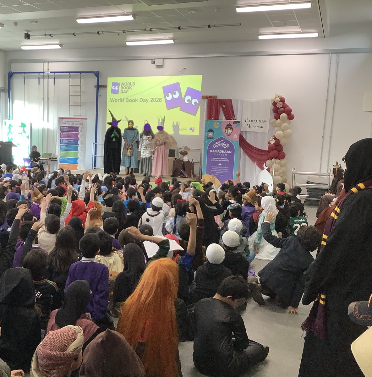 olive__preston's tweet photo. World Book Day 2026 assembly and staff on the stage! Well done to our children for guessing the theme in each year group. #WorldBookDay2026 #BringingLearningToLife #LoveReading #Inspired #Teamwork #Ambition #WeAreSTAR https://t.co/oTjkGzoWu0