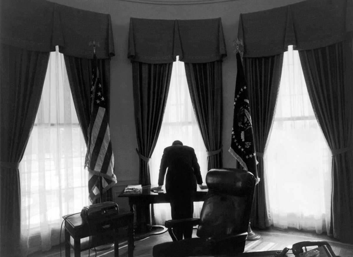 HistorylandHQ's tweet photo. President John F. Kennedy leans over his desk in this iconic photo, dubbed "The Lonliest Job." February 11, 1961. https://t.co/kKZackwCF2