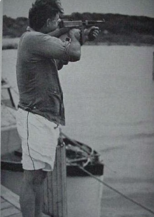 DocStrangelove2's tweet photo. Ernest Hemingway with his Thompson SMG, just off the coast of Key West, Florida. https://t.co/mA5O3iEI3r