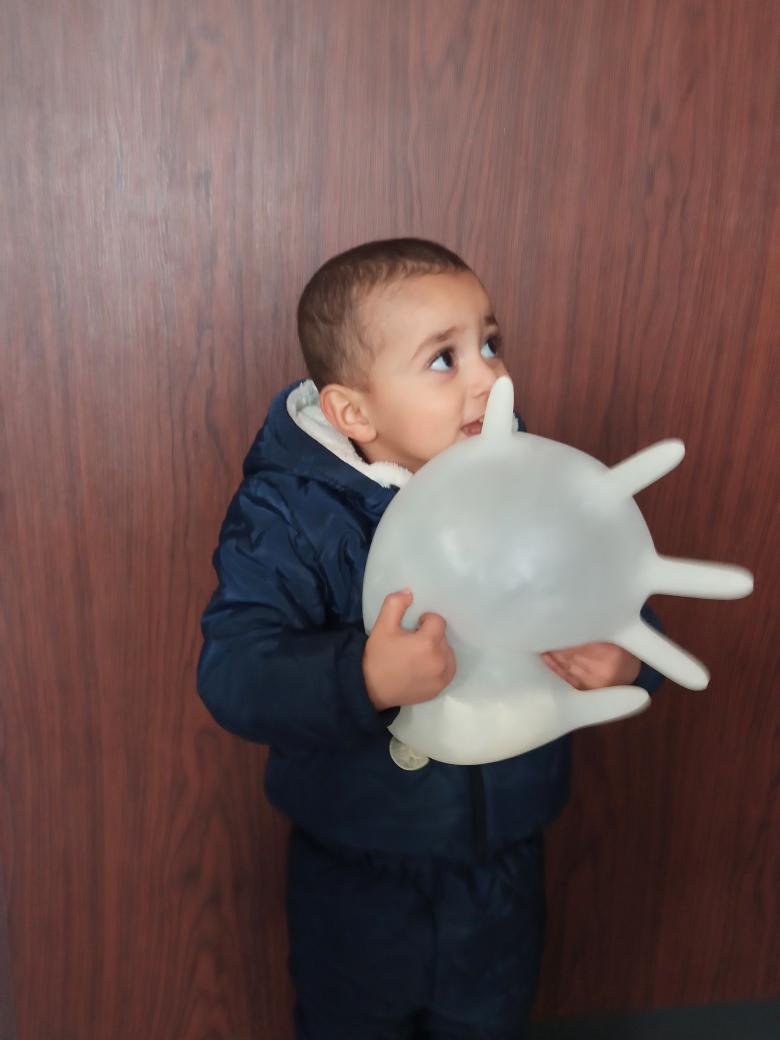 Manar6591912615's tweet photo. Fadi was born during the war in Gaza
He doesnt know toys we try to make him smile by blowing up medical gloves so they become his toys
 He doesn’t just need toys he need a chance to live his childhood in a safe place away from the horrors of war Help Fadi
https://t.co/AHOUR8S0BD https://t.co/rlsOtmVXwz