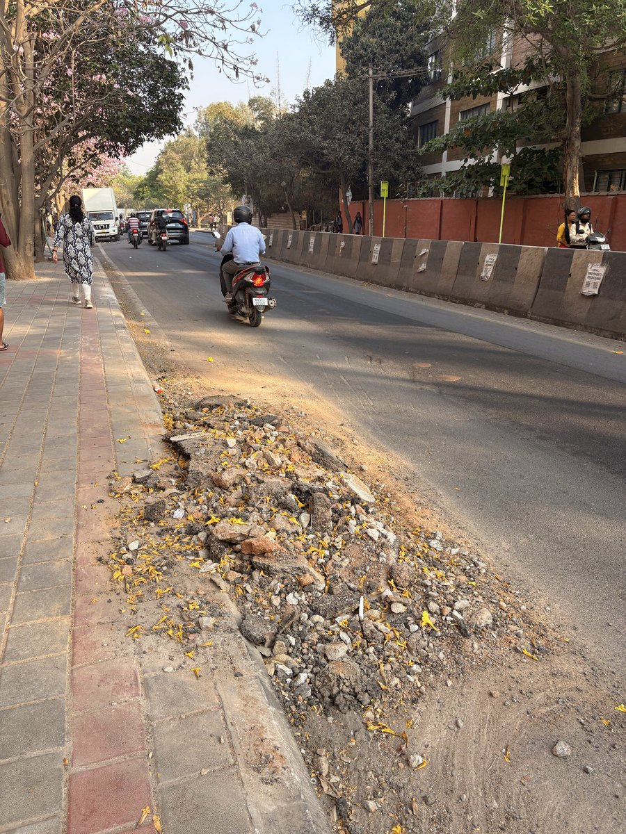 Anurag11's tweet photo. @GBAChiefComm newly laid road after a long wait has been dug up and left with rubble. Front of Gear school in Bhoganahalli. Pls help getting this fixed. https://t.co/6zWUHWwQjy