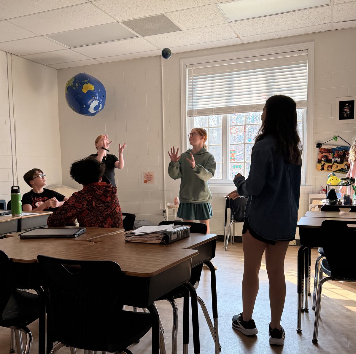 WCDS_Middle's tweet photo. Softly shooting a basketball? Maybe quietly playing monkey in the middle? How about aggressively passing the ball? Seventh grade language arts students were acting out adverbs today in class #WCDSMiddleSchool #WCDSAcademicExcellence https://t.co/r7f7cEaByu