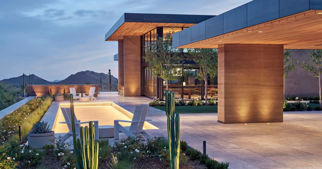 A lighted bocce ball court is tucked between the arcade and wellness areas at this private desert estate. The organic nature of the rammed earth walls add to the serene setting the homeowners desired.

To enjoy the entire project, follow the link >> bit.ly/3ZXI5yN