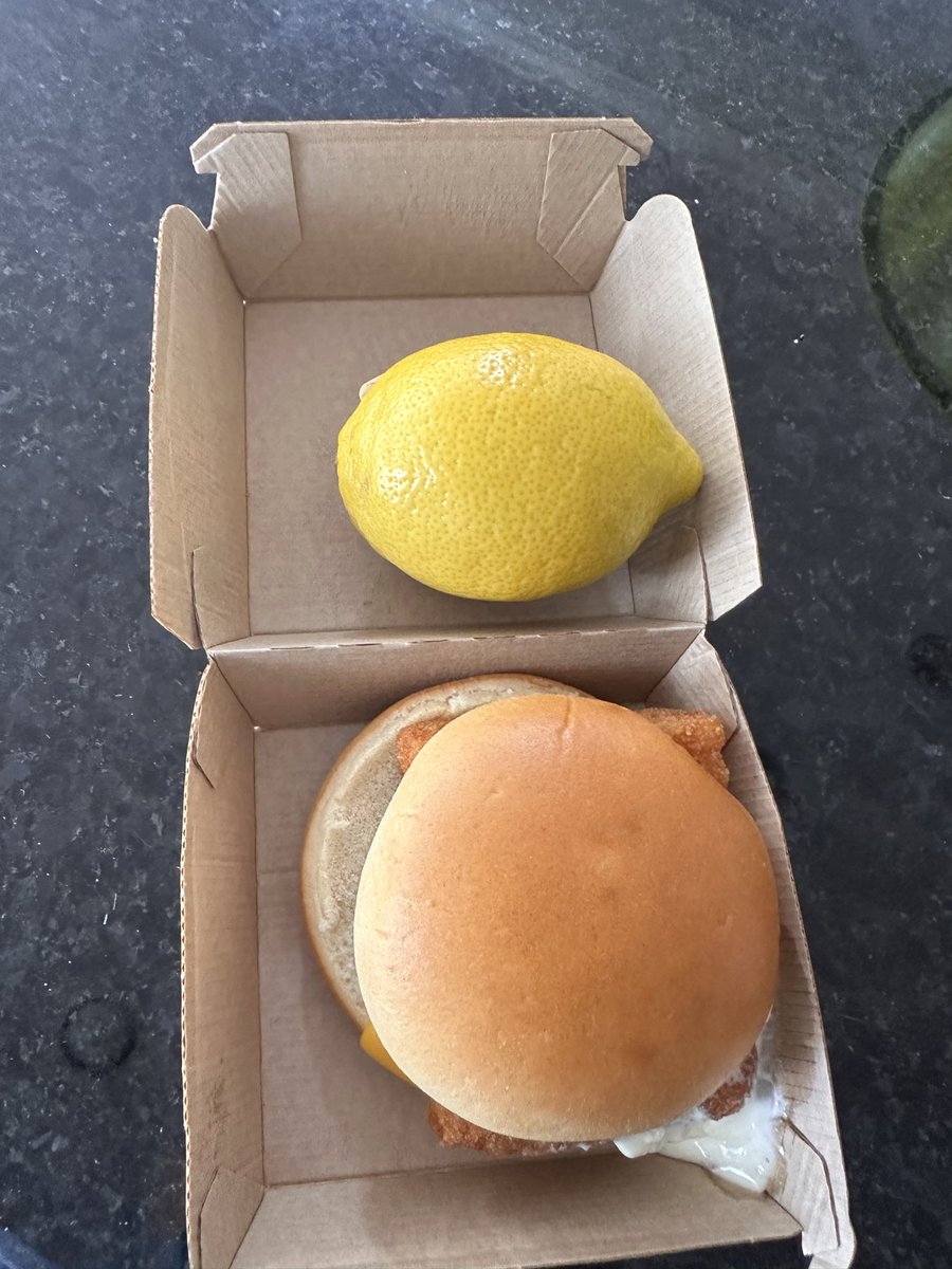 ClayGarrett3's tweet photo. Is this a joke, @McDonalds ?  Filet O Dish is a slider now? Lemon for size comparison. https://t.co/mVHloCkucW