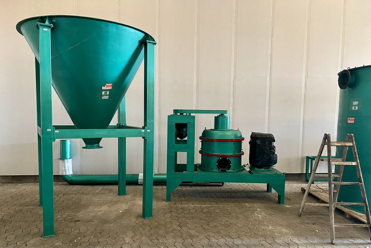 StefanBernstei3's tweet photo. Day 3, #Greenroc #graphite anode pilot plant. We have started laying out the line, mounted some of the structures and started building the first of the dust filters (large drums). Next to the base of dust filter (large cone) stands the QWJ60 Microniser mill (with red stribes). https://t.co/kx4t9BXNrL
