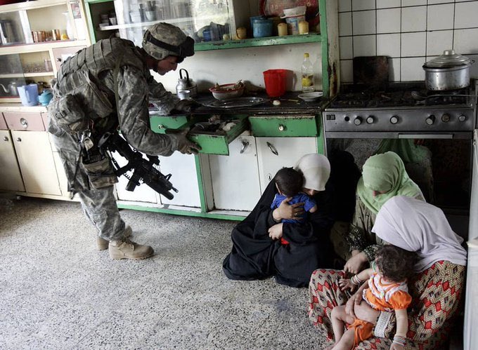 October 3, 2006, Iraq, Baghdad. A US soldier looking for Iraqi weapons of mass destruction in a kitchen.