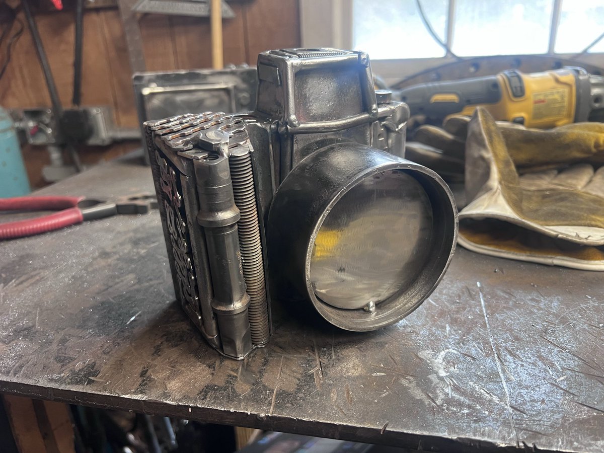 LongleyRd's tweet photo. Progress on the metal camera sculpture.

This one is built entirely from scrap steel and old tools. I’m trying to make it feel like a real vintage camera rather than an abstract piece.

Curious if anyone recognizes any of the parts used so far. https://t.co/BN8YSegoEc
