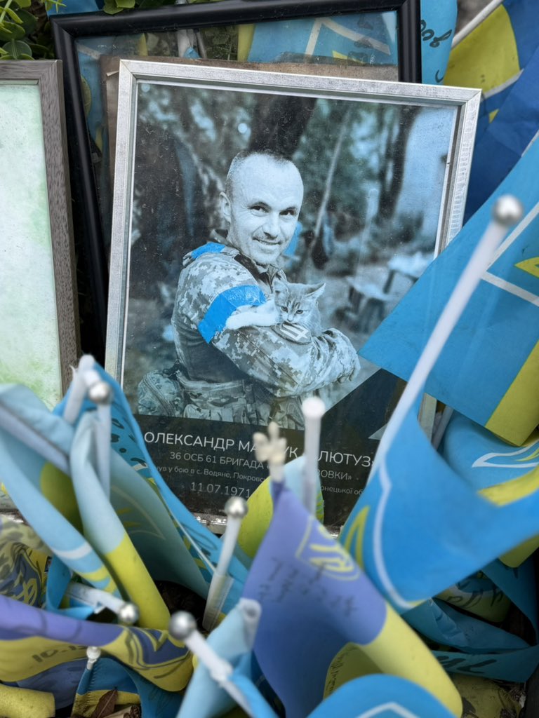natemook's tweet photo. The memorial in Kyiv’s Maidan square gets bigger every time I visit. It’s a painful reminder of the sacrifices Ukraine is making as it defends freedom &amp; democracy. Some of the photos include the heroes with their cats. 💔 We must keep helping, as they are fighting for all of us. https://t.co/oRUUvLHkoG