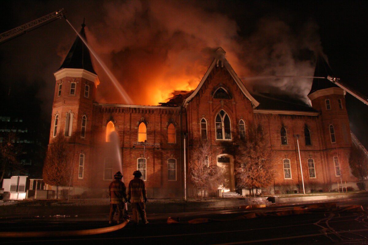 OnThisDayLDS's tweet photo. On this day in Church history:

March 20, 2016

The Prophet Dallin H. Oaks dedicates the Provo City Center Temple.

Then-Elder Oaks, who had previously served as President of BYU, was the first Apostle since Lorenzo Snow to dedicate a temple while serving as neither the President of the Quorum of the Twelve nor in the First Presidency (see photo 2).

The Provo City Center Temple was built from the charred remains of the Provo Tabernacle, which was badly damaged by fire in December of 2010 (see photo 3).

Although this was not the first time that a temple had been built from an existing structure it was truly a unique feat of architecture and engineering to build a new temple within the charred shell of a building that would ordinarily be slated for demolition. 

In order to accommodate the needs of a 21st Century temple within the relatively tight envelope of a pioneer-era tabernacle, many of the non-ordinance rooms ended up being constructed underground.

To accomplish this, a one-of-a-kind series of stilts were constructed to suspend the brick exterior in midair while a basement was constructed beneath it. (see photo 4).

Today, the Provo City Center Temple stands as a testament to God’s love for His children and His ability to repair and renew even that which appears beyond all hope.
