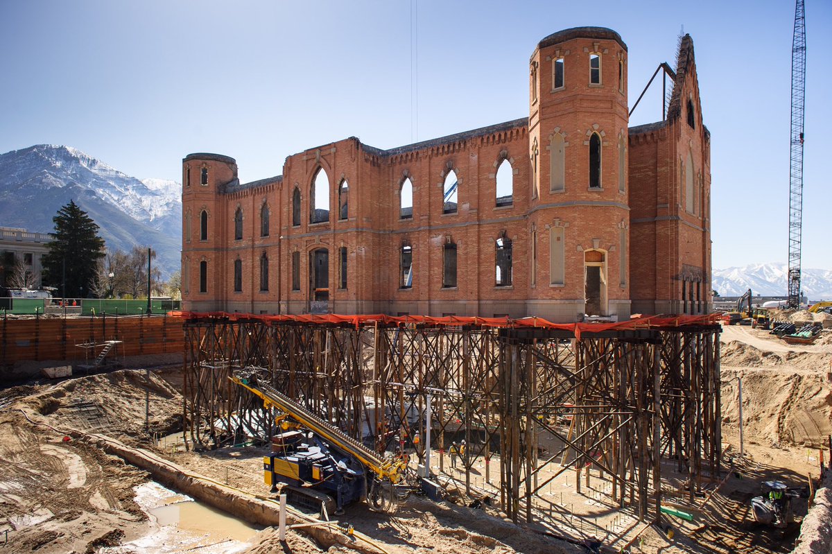 OnThisDayLDS's tweet photo. On this day in Church history:

March 20, 2016

The Prophet Dallin H. Oaks dedicates the Provo City Center Temple.

Then-Elder Oaks, who had previously served as President of BYU, was the first Apostle since Lorenzo Snow to dedicate a temple while serving as neither the President of the Quorum of the Twelve nor in the First Presidency (see photo 2).

The Provo City Center Temple was built from the charred remains of the Provo Tabernacle, which was badly damaged by fire in December of 2010 (see photo 3).

Although this was not the first time that a temple had been built from an existing structure it was truly a unique feat of architecture and engineering to build a new temple within the charred shell of a building that would ordinarily be slated for demolition. 

In order to accommodate the needs of a 21st Century temple within the relatively tight envelope of a pioneer-era tabernacle, many of the non-ordinance rooms ended up being constructed underground.

To accomplish this, a one-of-a-kind series of stilts were constructed to suspend the brick exterior in midair while a basement was constructed beneath it. (see photo 4).

Today, the Provo City Center Temple stands as a testament to God’s love for His children and His ability to repair and renew even that which appears beyond all hope.