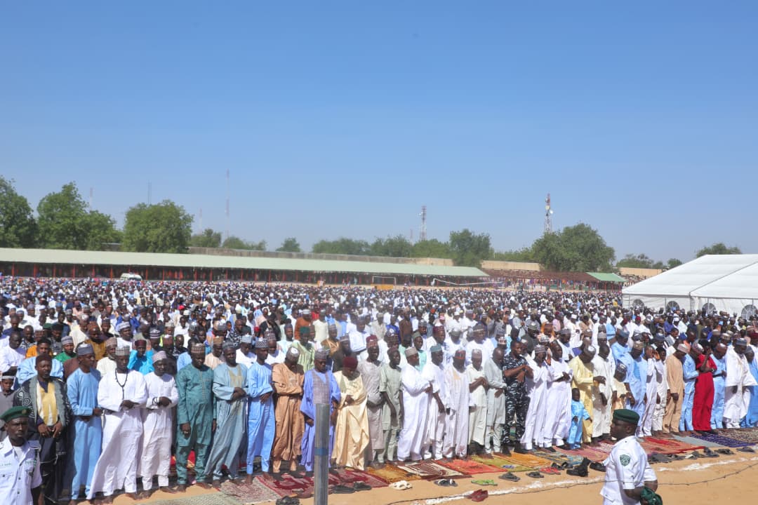BMB1_Official's tweet photo. VP Shettima, Zulum Attend Eid Prayers at Ramat Square as Worshippers Observe Sallah Peacefully in Maiduguri.

Vice President, Senator Kashim Shettima, Borno State Governor, Professor Babagana Umara Zulum, joined thousands of muslim faithful to observe the Eid prayers at Ramat Square, Maiduguri.

The two units prayer were observed peacefully at the main Eid ground and other prayer grounds across the state under tight security, marking the end of the month-long Ramadan fast.

In a sallah message shortly after the sermon by the Imam Idaini of Borno, Shettiima Mamman Saleh, the Vice President called for unity and peaceful coexistence in the state and the country as a whole.

Senator Shettima assures the Federal Government 
Commitment to protecting the lives and properties of the citizenry, stressing that the fight against insurgency would be tackled head-on.

The Imam Idaini admonished worshippers to imbibe the lessons learned during the holy month and encouraged Muslim faithful to give alms to the poor (zakatul fitr) and to fast six days in the month of Shawwal to receive Allah's bounties and rewards.

Borno State Governor, Professor Babagana Umara Zulum, in a sallah message, called on faithful to recharge their spiritual beings towards rebuilding a secure, peaceful, and prosperous Borno.

He saluted the courage, resilience, and commitment of the people to all initiatives aimed at deepening security and peace-building among the various components of society, fragmented by the Boko Haram insurgency over the years.

The Eid prayer was attended by the Shehu of Borno, Shehu Abubakar Ibn Umar Garbai Almin El-Kanemi; the Borno State Deputy Governor, Umar Usman Kadafur; the APC Deputy National Chairman, North, Senator Mohammed Ali Ndume; and Senator Kaka Shehu Lawan SAN, Minister of State for Regional Development.

Other dignitaries include members of the House of Representatives and the Borno State House of Assembly, former deputy governors, the Secretary to the State Government, Commissioners, APC stalwarts, and other top government officials.