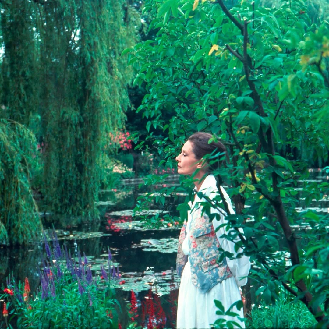 Audrey Hepburn photographed by Mick Hales in Monet’s garden during the filming of Gardens of the World, Giverny, France, 1990