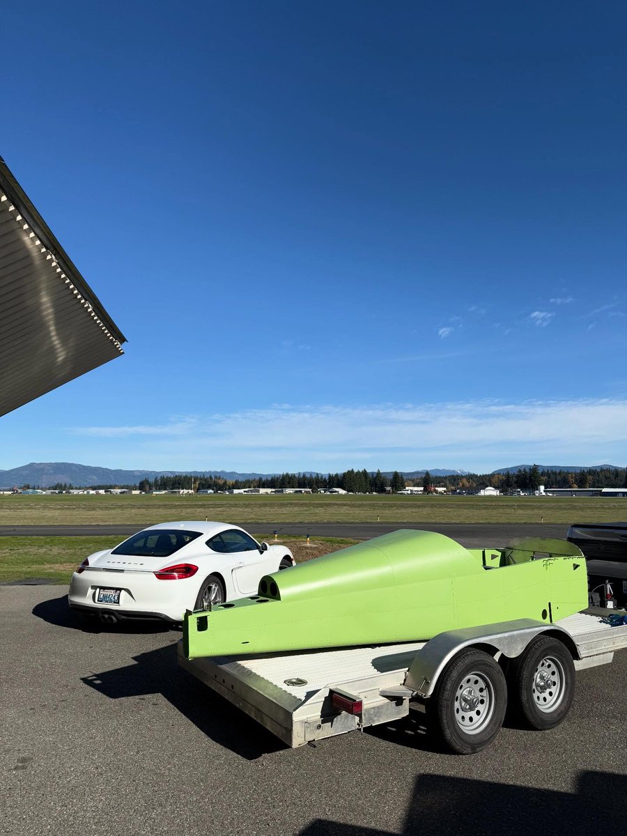 Flight Warrior Mode: Boxster towing a green rocket plane to the helipad! Nothing beats driving up there and taking off like that. Who else tows flying gear like this? #PorscheLife #PilotLife #AviationTrailer