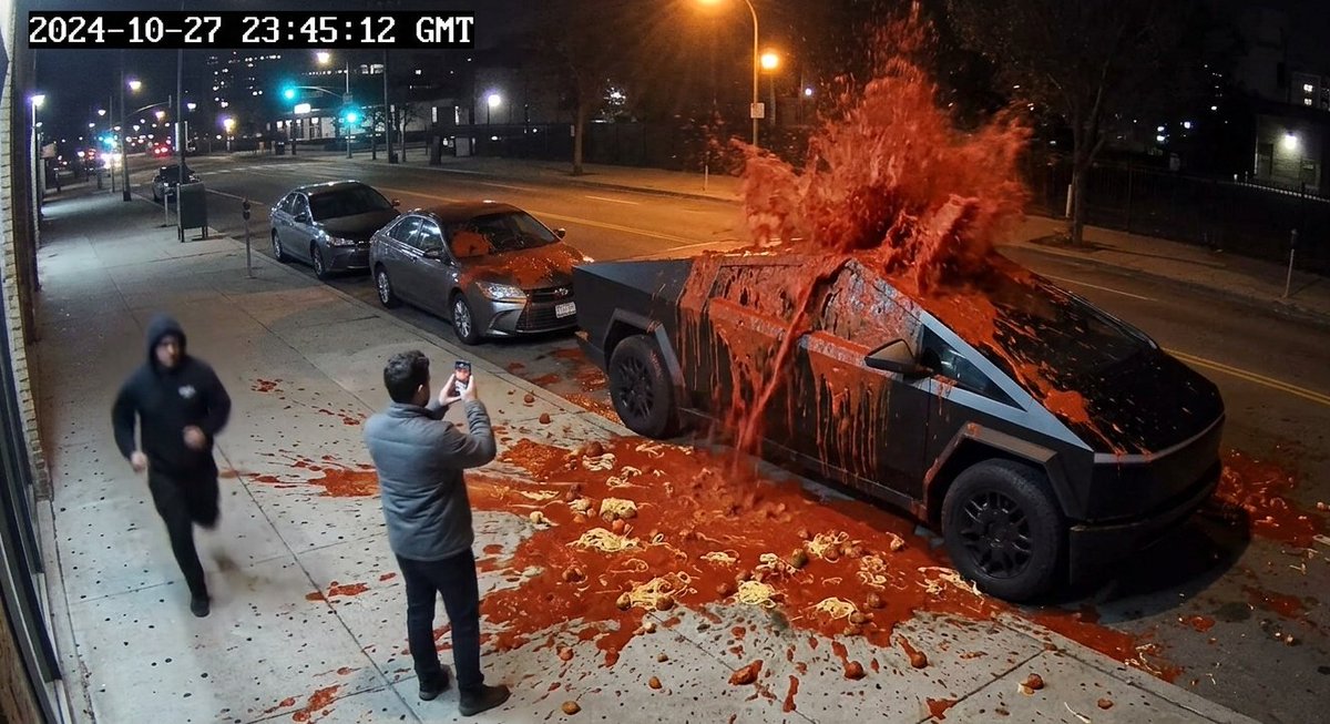 EmalinNorth's tweet photo. CCTV caught the exact moment bro’s car got jumped by marinara 😭🍅

Bro said ‘no sauce’… so they baptized the whole Tesla Cybertruck.
Police report: suspect fled the scene… sauce still at large @MarinaraSols