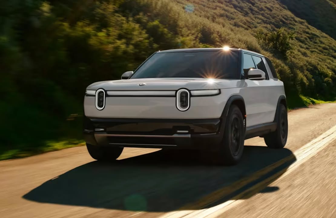 OptiCarAI's tweet photo. Sixty Grand for a "Budget" SUV? Welcome to the Rivian R2 Launch (Read more: https://t.co/pKmEIuYe05 ) #opticar #price360 #Rivian #rivianr2 #electricvehicle https://t.co/W9OD4DrrKu