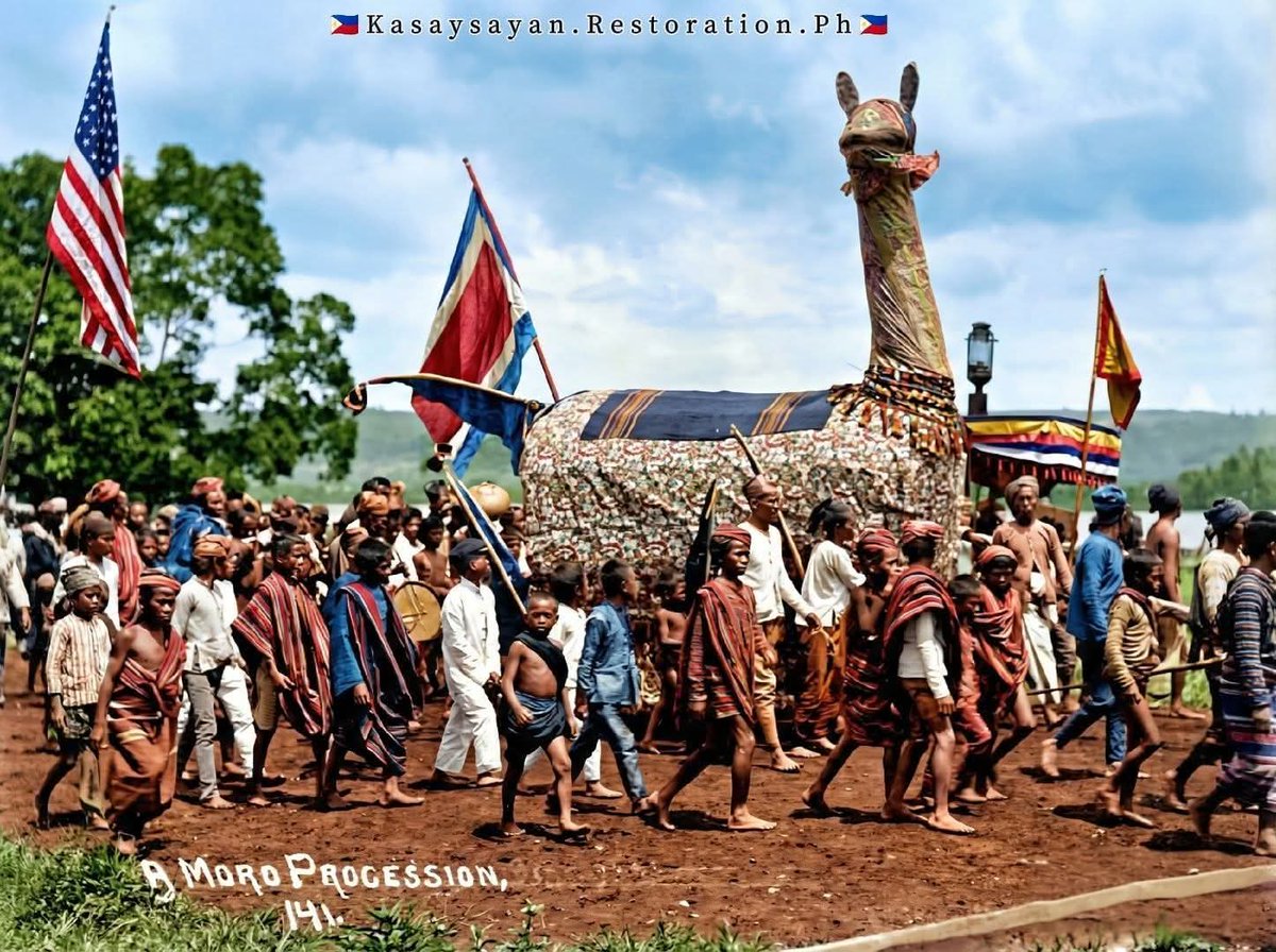 KRestorationPh's tweet photo. Isang bihirang sulyap sa prusisyon sa Mindanao (early 1900s).

From B&amp;W to historically informed colorization—based on sources, not guesswork.

AI-enhanced for education.

#KasaysayanRestorationPH #MindanaoHistory #PhilippineHistory https://t.co/DbrbgN3qx1
