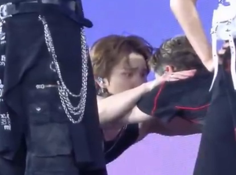 crazy facial expression to pull when you're stretching with your bandmate whom you share this decade long situationship while maintaining eye contact