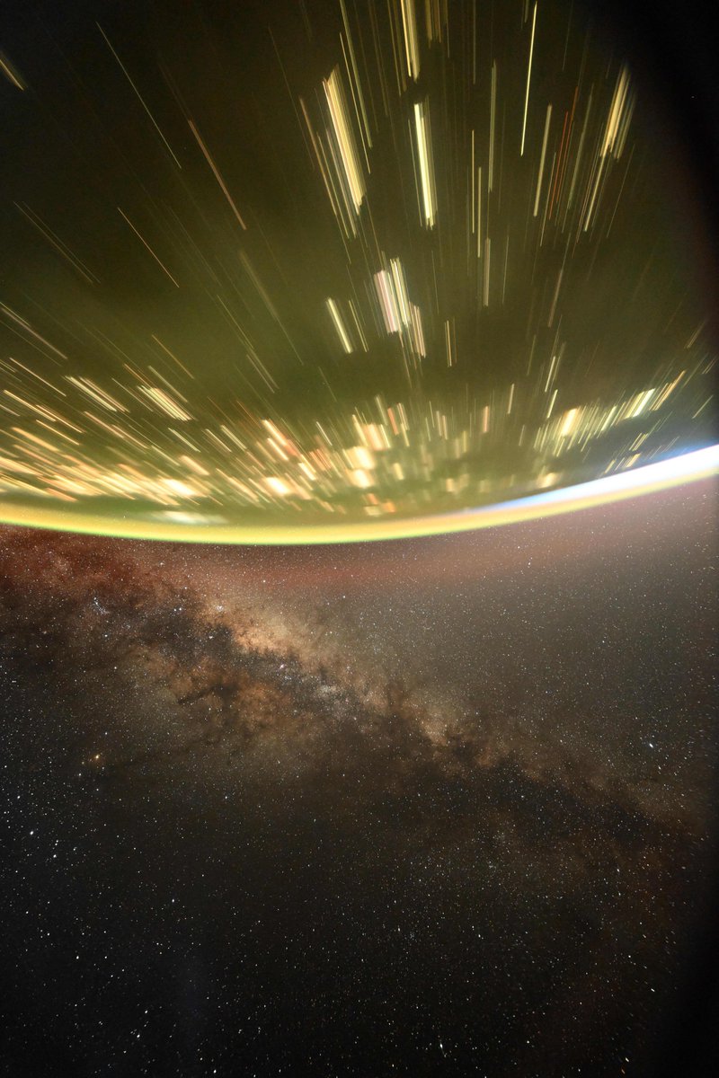 The Milky Way as seen from <a href="/Space_Station/">International Space Station</a>, with stars as points, rising sun, and cities as golden streaks below.

Taken with Nikon Z9, Sigma 14mm f1.4 lens, 15 seconds, f1.4, ISO 6400, with homemade orbital sidereal drive to compensate for orbital pitch rate (4 degrees/min)
