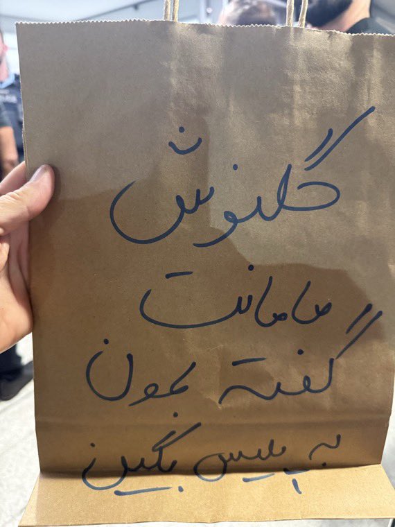 Some random things make Iranians burst into tears instantly, and they’re almost impossible to explain to the world.

This message, written on a shopping bag and held up by an Iranian in Australia, was one of them.
It was meant for an Iranian soccer player:

“Golnoosh, your mom