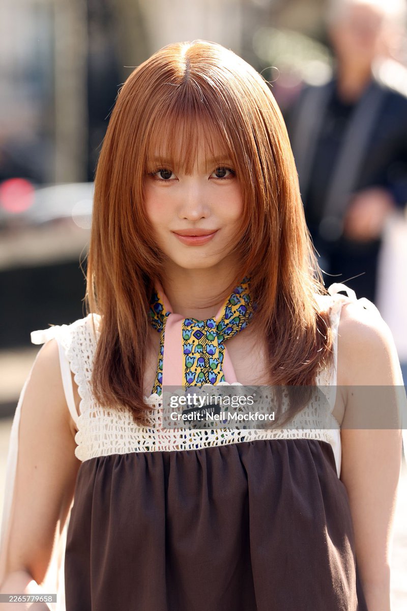 MOMO of TWICE looks stunning, serving face like no Barbie could at the Miu Miu show.