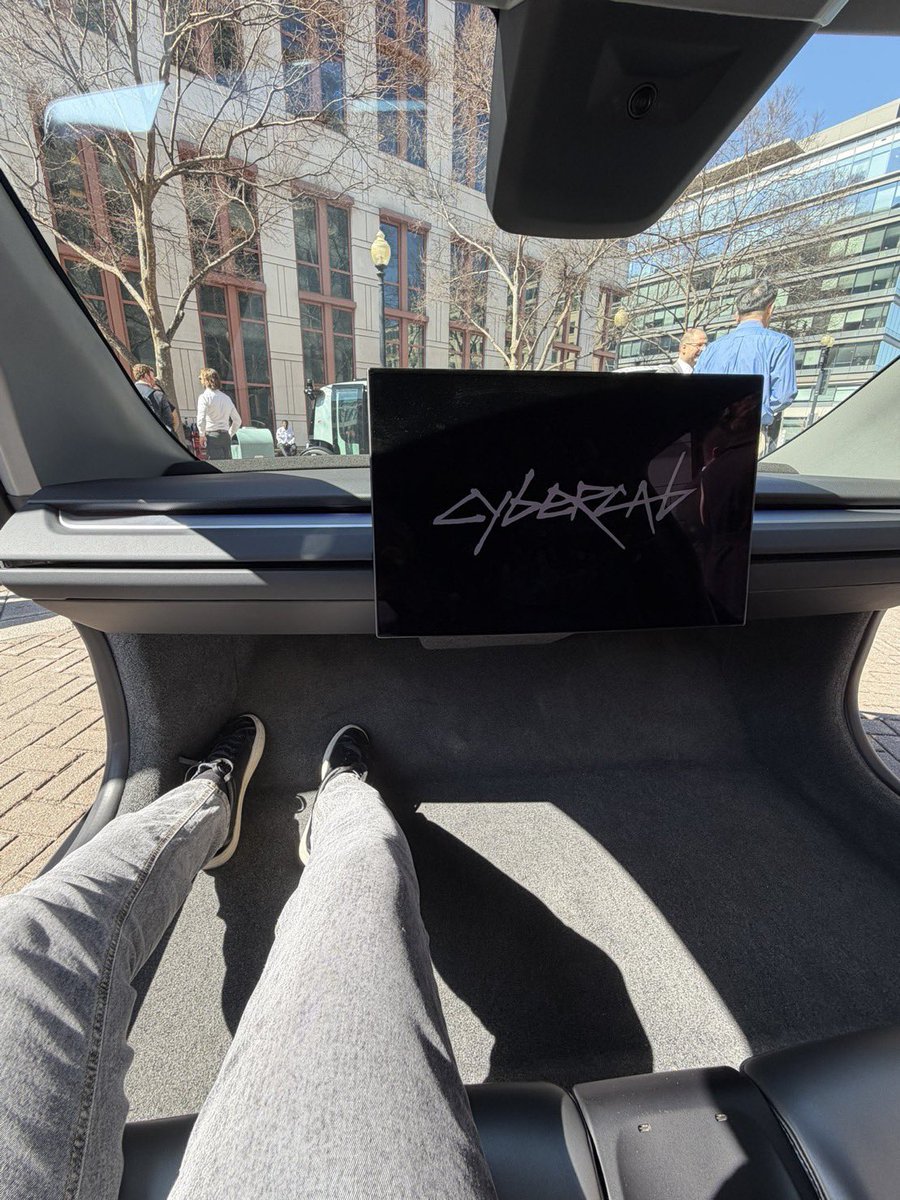 Cybercab Lettering The Tesla Cybercab includes an emergency stop button on the overhead ...