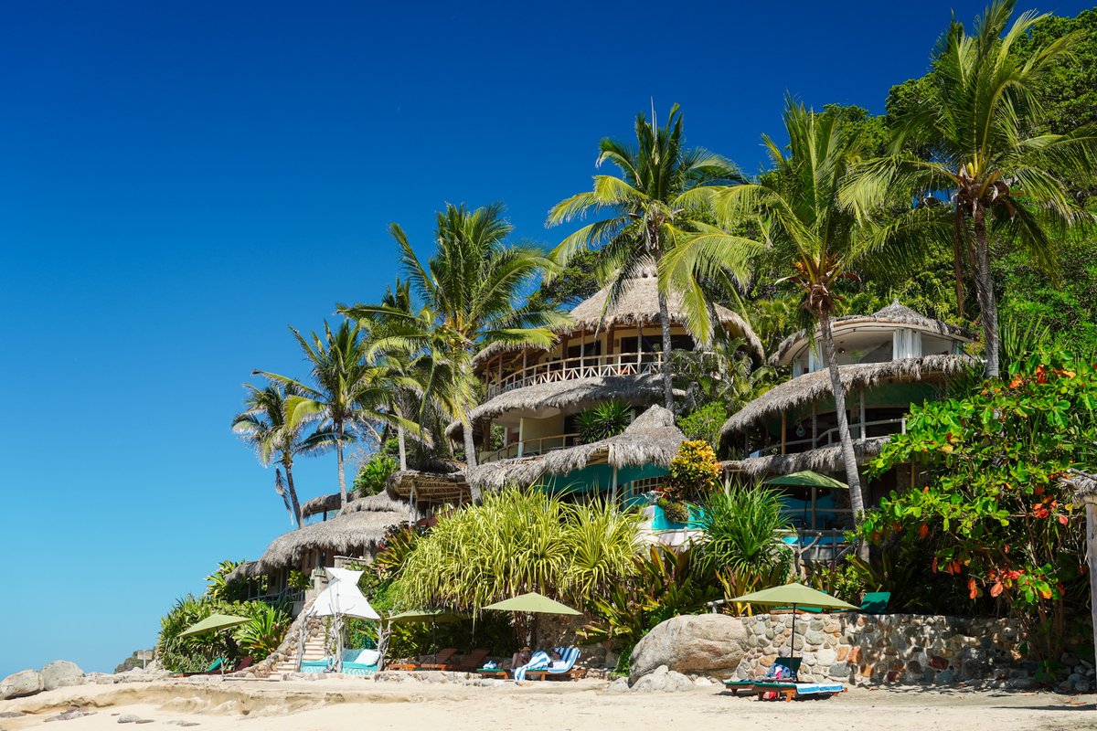 playaescondida's tweet photo. A secluded beach hotel, your secret refuge by the ocean. 🌴 Can you imagine waking up to this view? #PlayaEscondida https://t.co/lp2xnm6q85
