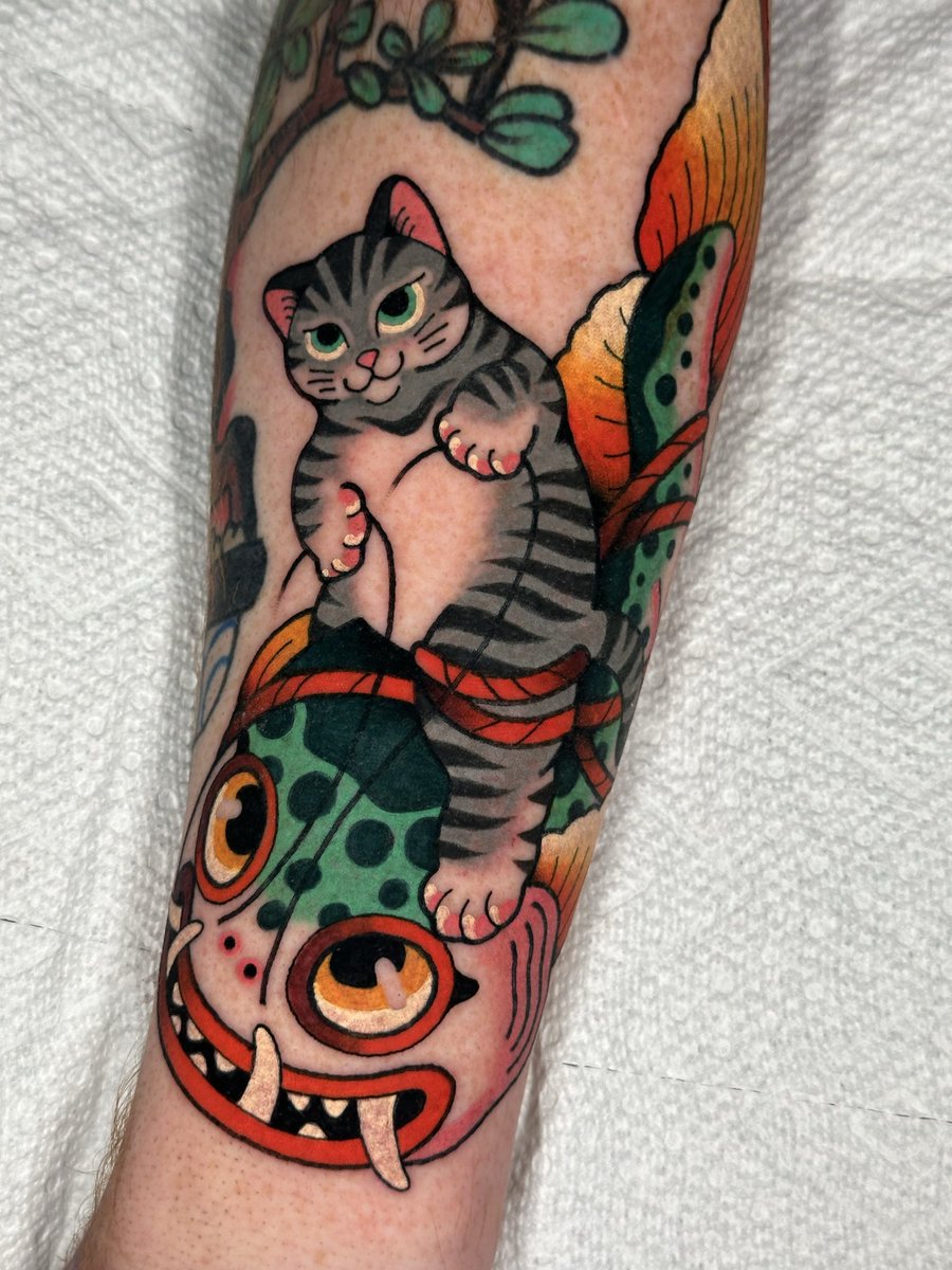 Cat riding a catfish