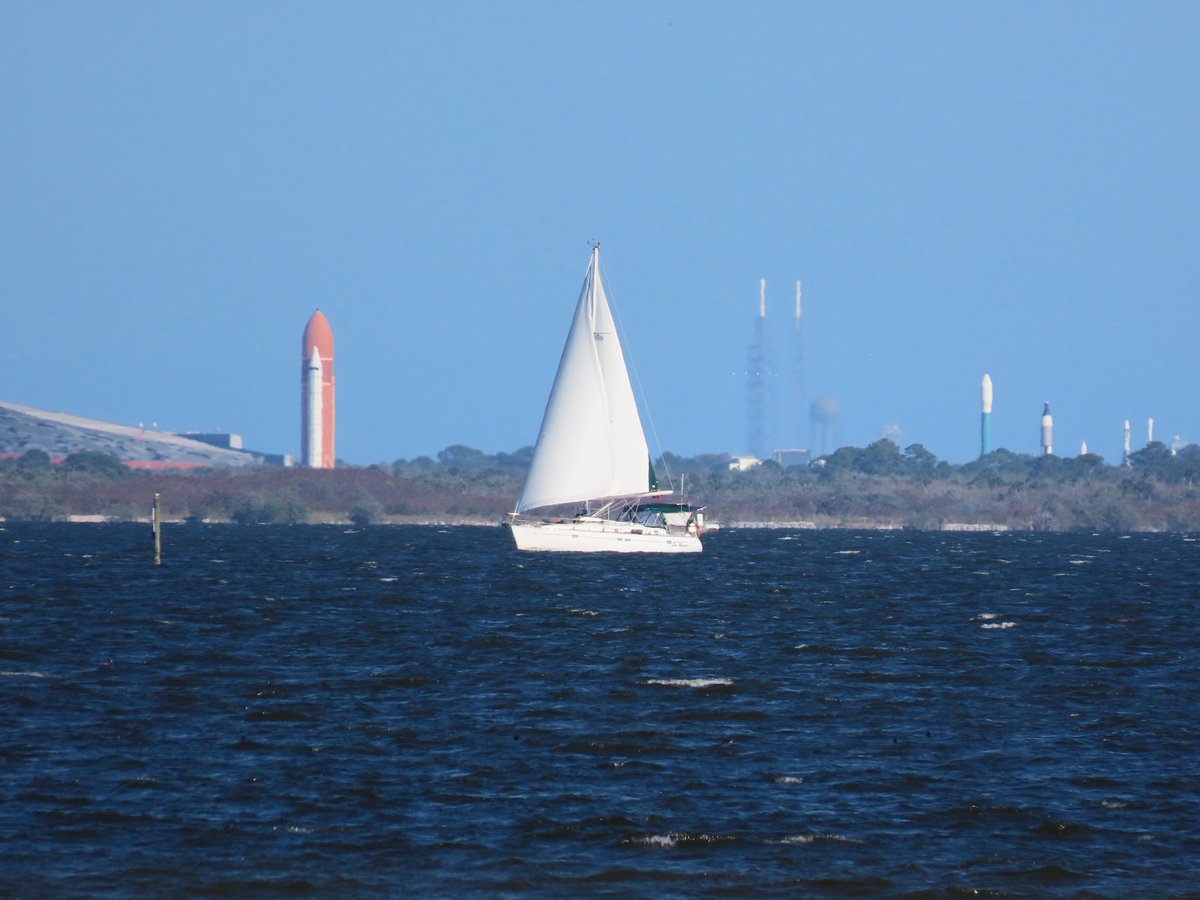 Nice day for wind surfing and sailing on the river.