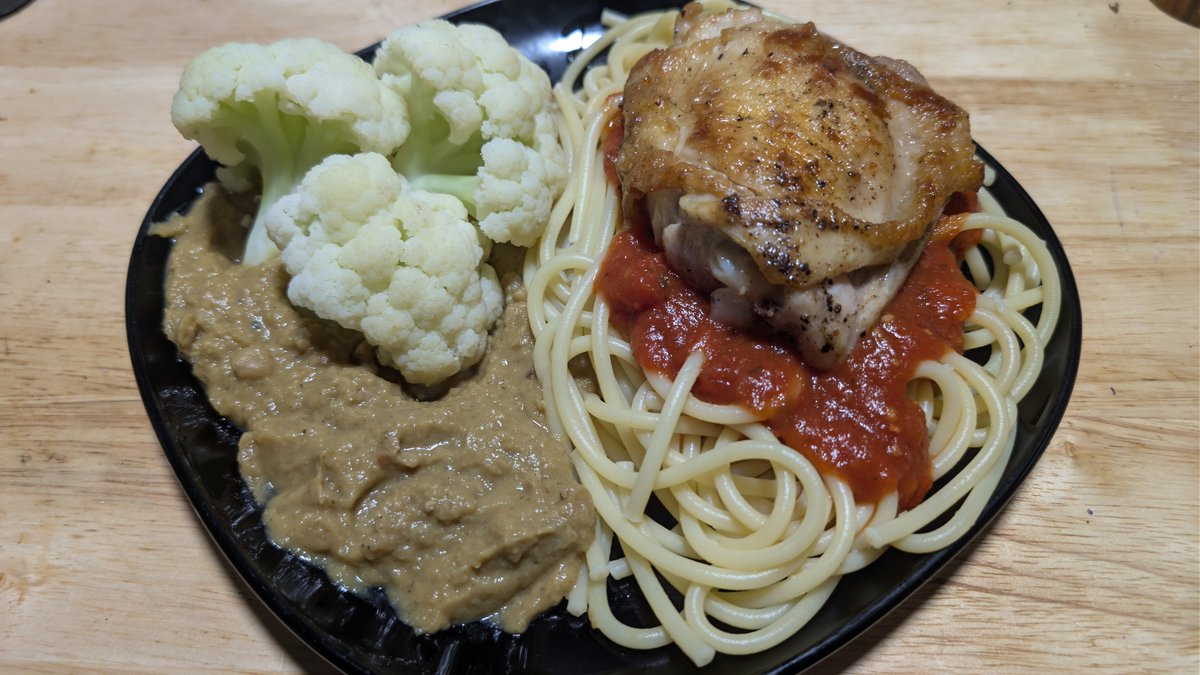 Falconeio's tweet photo. Juicy and crispy pan fried chicken thigh on a bed of Bucatini, hollow pasta, and spaghetti sauce. Creamy yellow split pea dahl with perfectly cooked and seasoned Chinese cauliflower. https://t.co/Ro1bNk7zGL