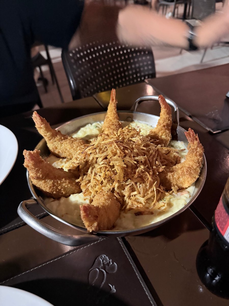MarioELT's tweet photo. On a base made of rice and cream, they placed breaded shrimp stuffed with cheese, and then covered the center with fried grated potatoes. I guess it’s a triple sin but the dish was delicious! https://t.co/kZ0CnuFo3e