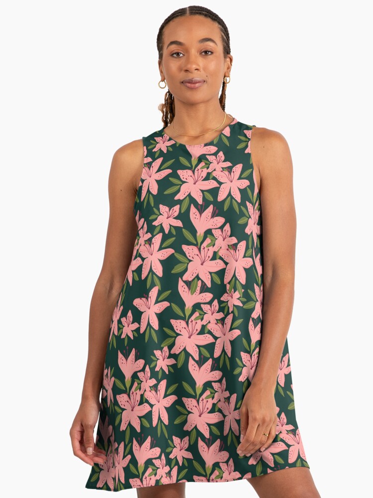 ExcesssShop's tweet photo. Get my art printed on awesome products. Support me at Redbubble #RBandME:  https://t.co/pfolV2HNOd #findyourthing #redbubble 
This seamless floral pattern features soft pink lily blossoms scattered across a deep forest-green background for a bold, elegant botanical look. Each flower is illustrated with clean, modern shapes and subtle dot detailing, with dark stamens and speckled petals that give the lilies a distinctive, recognizable character. Olive-green leaves and small sprigs fill the negative space, creating a balanced repeat that feels lush, airy, and naturally arranged.

The color palette pairs blush and coral pinks with rich evergreen tones, delivering a romantic garden vibe with a slightly moody backdrop. The contrast makes the blooms pop while keeping the overall design sophisticated and easy to style. With its crisp vector-like finish and gentle, feminine feel, this pattern fits cottagecore aesthetics, modern botanical decor, and anyone who loves floral repeats inspired by lilies, spring gardens, and blooming greenery.

Search-friendly keywords such as pink lily pattern, forest green floral background, seamless botanical repeat, stargazer lily illustration, and scattered blossom print closely match the artwork’s theme and help it surface in floral and surface-pattern searches—without relying on generic product terms.