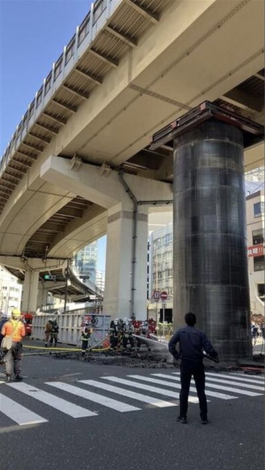 ChinaNow24's tweet photo. A strange incident occurred yesterday in Osaka, Japan. Near the Umeda Center Building on the west side of Shin-Midosuji, a huge unidentified object resembling a bridge pier suddenly emerged from underground. The entire area was closed to traffic, and the scene was chaotic. https://t.co/GxXM4CvrQf