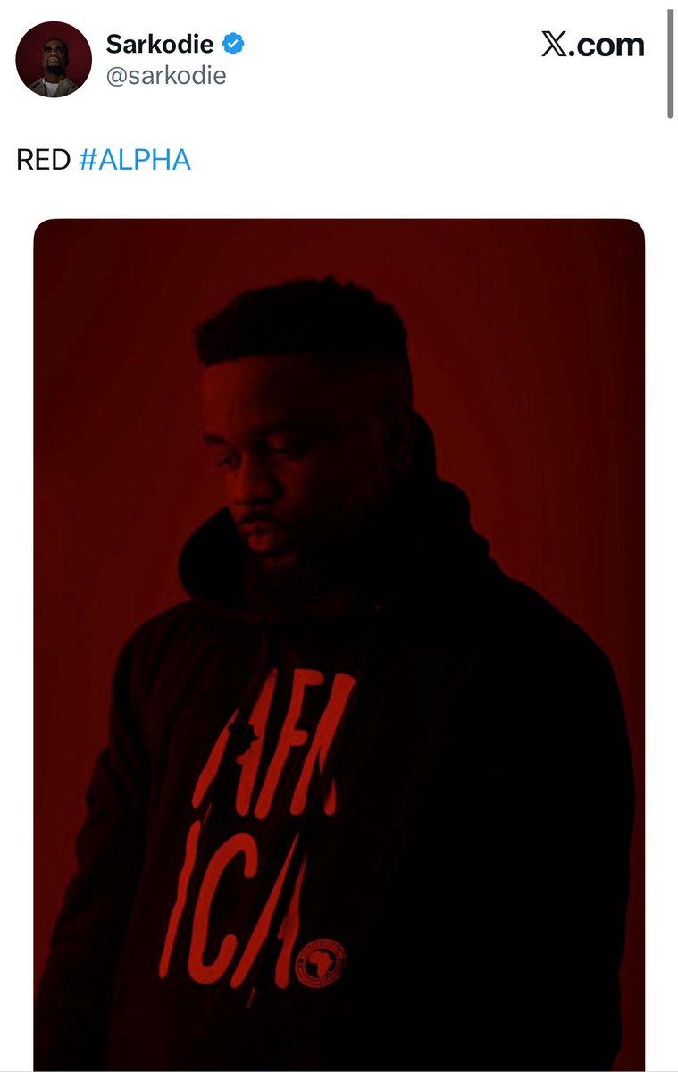 thejosephmireku's tweet photo. Well, since you asked, here we go:

The scene opens with an “a capella” rendition of lyrics referencing his goal of selling out the O2. This seems normal. But if you look closely, you see he’s set against a red backdrop, which is strange because for filming and production, you would normally expect a greenscreen. Straightaway we see the “eye-red”, the sweat, the blood, and the suffering creating the background with which he has gotten so far.

The red serves a hidden purpose too. The red cape is what a matador waves in front of an angry charging bull. Throughout his career, he has had these big charging bulls always attacking his progress. This is the moment where he waves the red cape. Though entertaining for his admirers and fans, it will inevitably lead to the humiliation of the charging bulls. 

The red also recalls the campaign around the Alpha album, where red was heavily used as the central visual theme, and it eventually became the colour scheme for that year’s Rapperholic concert in 2019 (7th edition. We will come to this later).

Moving on, the camera pans out and we see a clapperboard showing 777. Sarkodie likes to rap about his hustle, but which song is his most personal and powerful exploration of his suffering? Mile 7 Freestyle. The show will also take place in 2027, on the occasion of Ghana’s 70th Independence Anniversary. You might think it’s 7 not 70 so this is stretching it, but..Sarkodie was born on 10 July, i.e the 10th day of the 7th month. 10*7 gives you 70. Interestingly, the 2019 Rapperholic concert, which carried the strong red theme during the Alpha campaign, was also the 7th edition of Rapperholic.

Finally, Sark is looking at the viewer mot of the time, but just when the actual shoot starts with the clapperboard, he begins to walk away. He wants you to come with him on this journey. He wants you to be part of this historic moment.