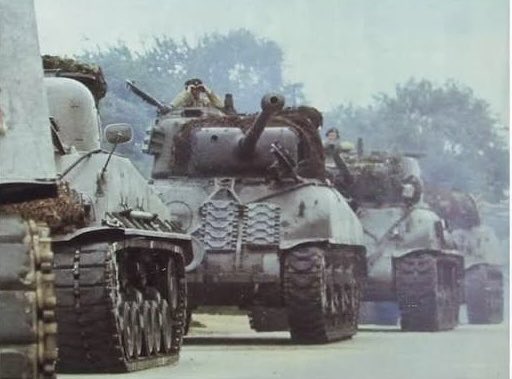 bombat_coot's tweet photo. *BREAKING*
As we hear yet more denials of boots-on-the-ground, pictures showing a US Division heading to a Netherlands’ embarkation point earlier today, surface on the web 😳 https://t.co/p2hmu1bnBC