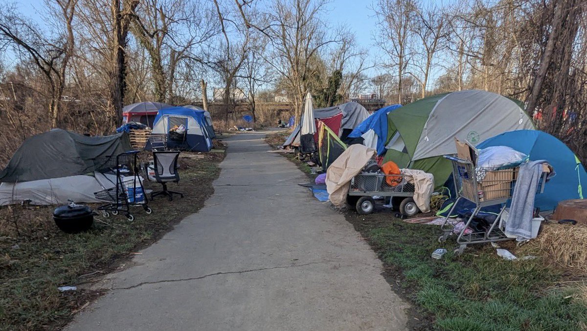 There is a homeless encampment in the City of #CharlottesvilleVA under Free Bridge on the Rivanna Trail next to the Rivanna River. 

Tons of trash, tents and trauma.

Today, City Hall announced it would provide “wrap-around services” for the encampment, including portable