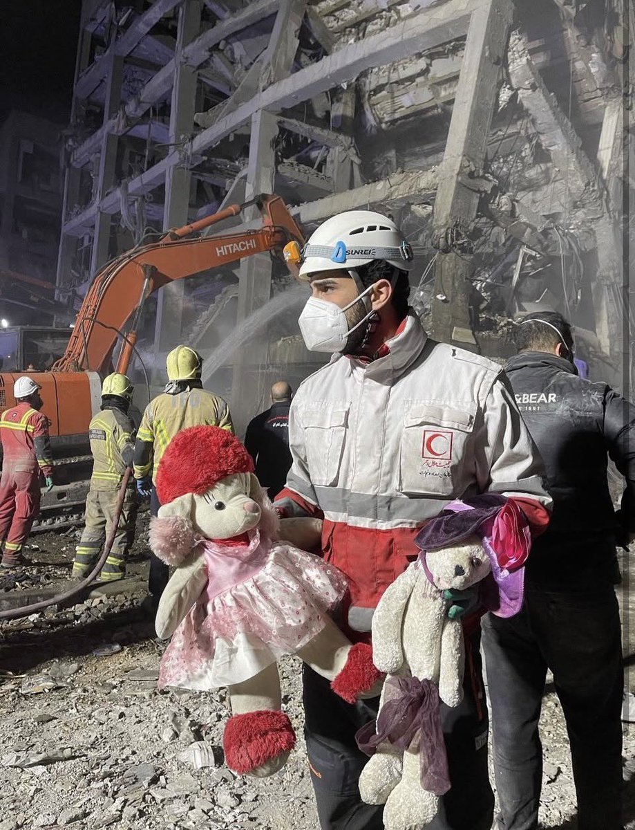 Gut wrenching photo of Red Crescent rescue workers in Tehran recovering toys belonging to the children killed in US/Israel strikes.