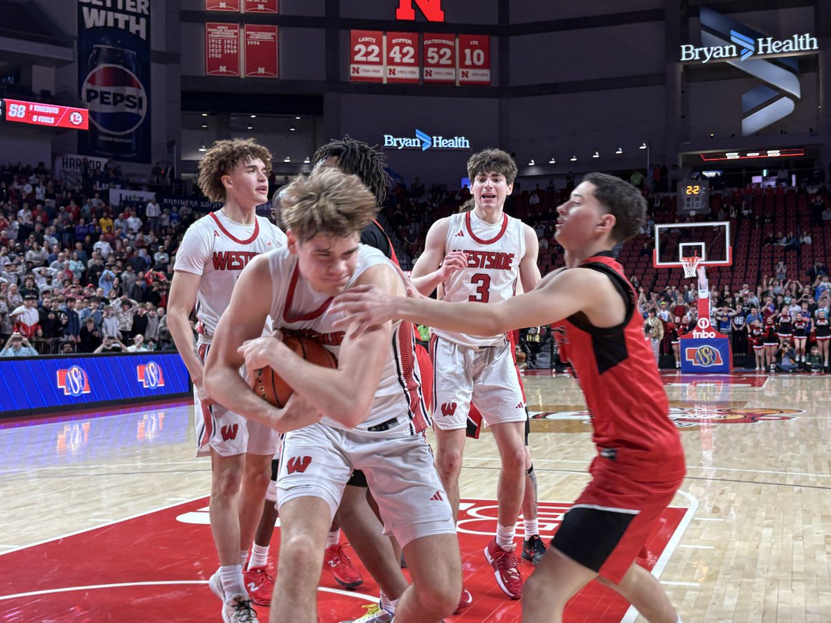 Westside’s William Preston secures a critical rebound late in the fourth-quarter to preserve a 61-58 win over Lincoln High in the first-round of the Class A boys state basketball tournament this afternoon.