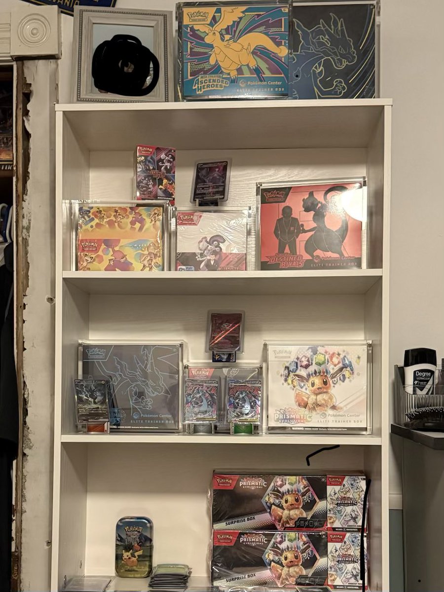 mertz08's tweet photo. @PokeCardsDaily Tin display sits nicely sealed on my shelf in an acrylic case https://t.co/3hh6nKs3iZ