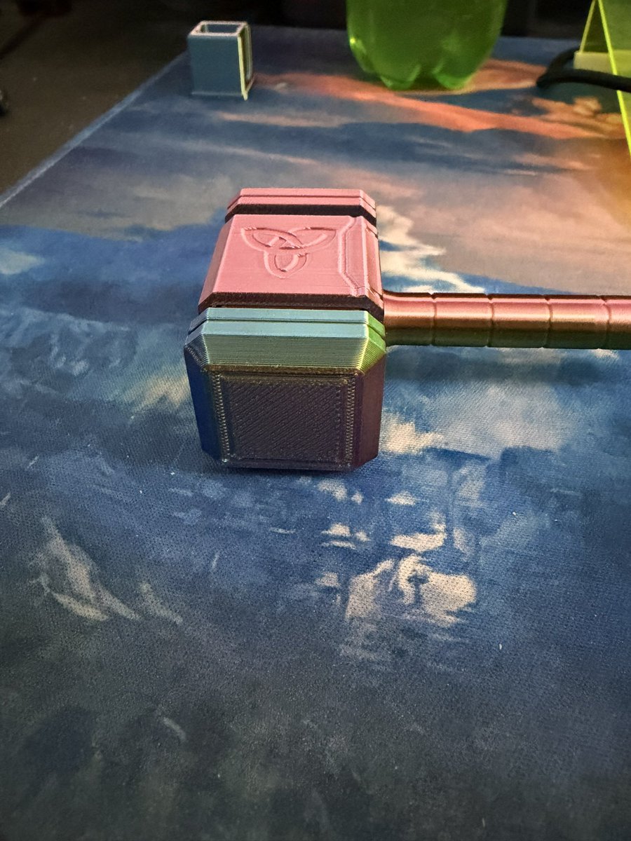 CheezyJokester's tweet photo. Made this Thor hammer fidget toy tonight. The hammer part spins and the ends are clicky. Did it a multi color filament. https://t.co/YfR5E9ACTe