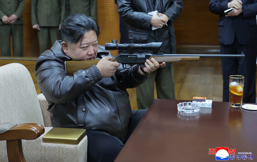 NEW - Kim Jong Un is seen checking and firing guns in media published by state media