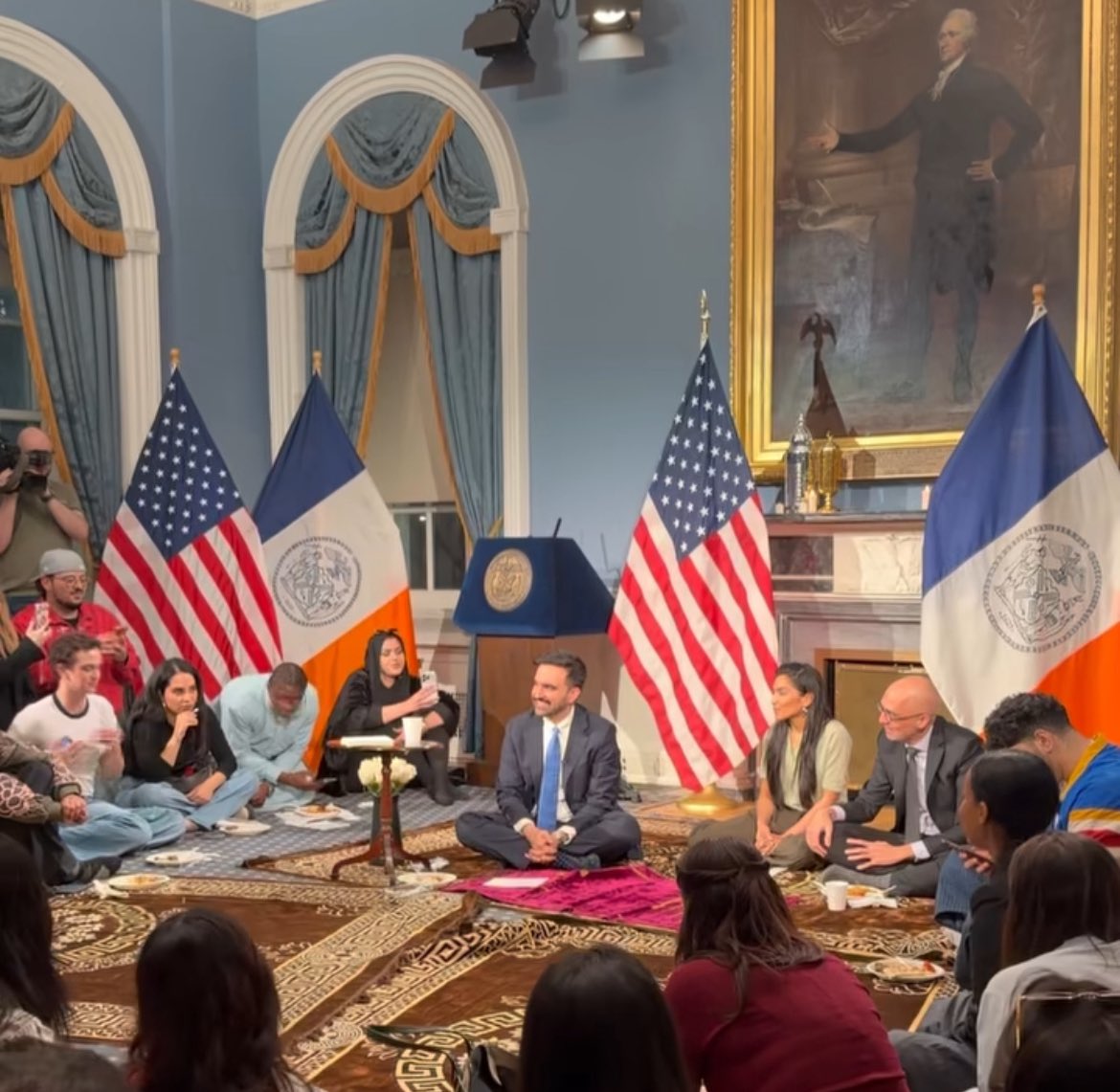 The fact that he is currently the most famous American Muslim gives the impression that this is how 1.5 billion Muslims break their fast on Ramadan, sit on the floor, put food next to their feet, and eat.
This is NOT how all practicing Muslims do it. Mamdani brings his own