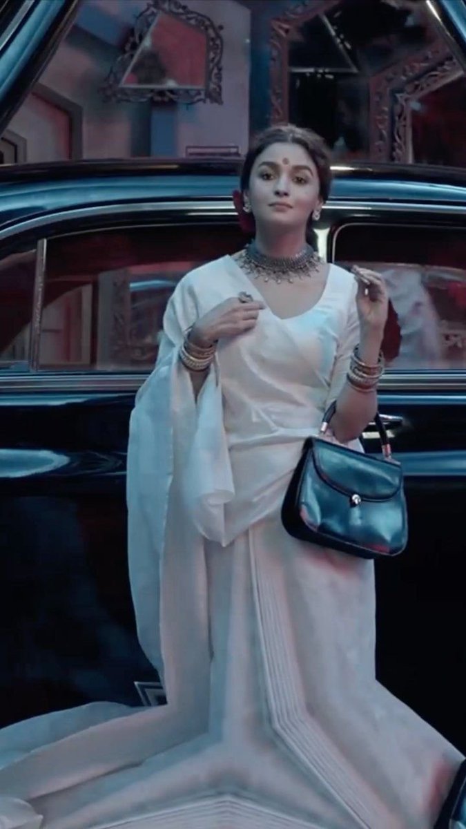 skillinabox's tweet photo. Vintage car, white saree, fearless aura 
straight out of a Gangubai moment. 🤍✨ #BollywoodAesthetic https://t.co/40YgOazJgU