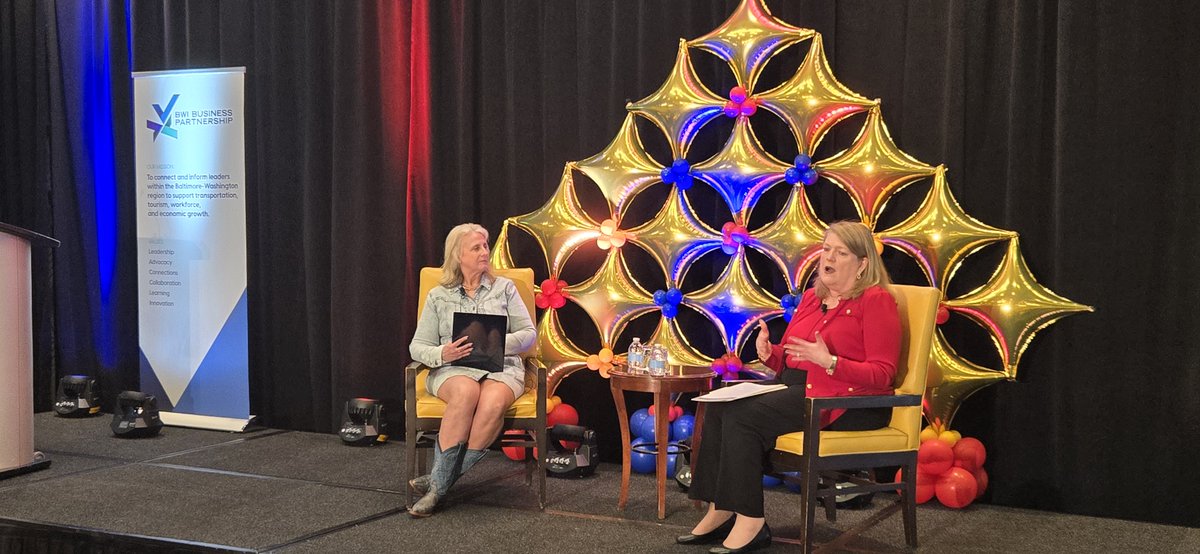 Gina Stewart of the BWI Business Partnership is talking with Aileen Furlong of Southwest Airlines at this morning's Signature Breakfast. The event is underway at the BWI Marriott.