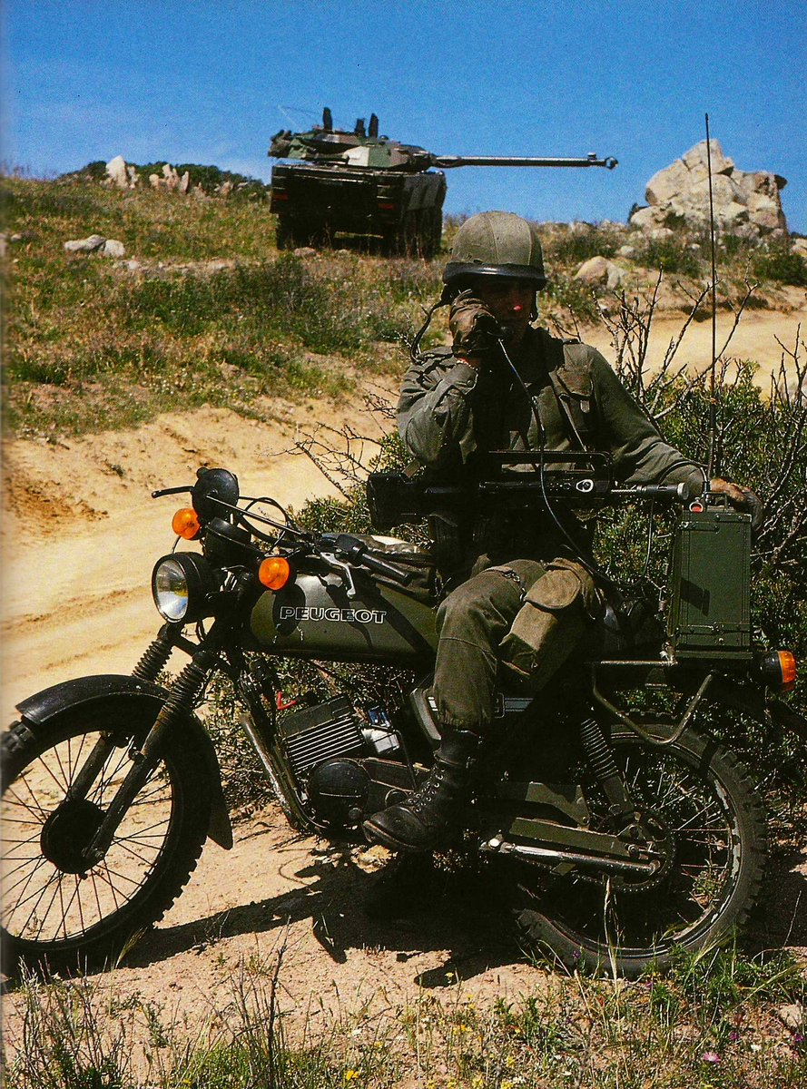 Motorcyclist and AMX-10RC of the 1st Squadron, 1st Foreign Cavalry Regiment (1er Escadron, 1er REC) during exercise 'Dragon Hammer 90' in Sardinia.