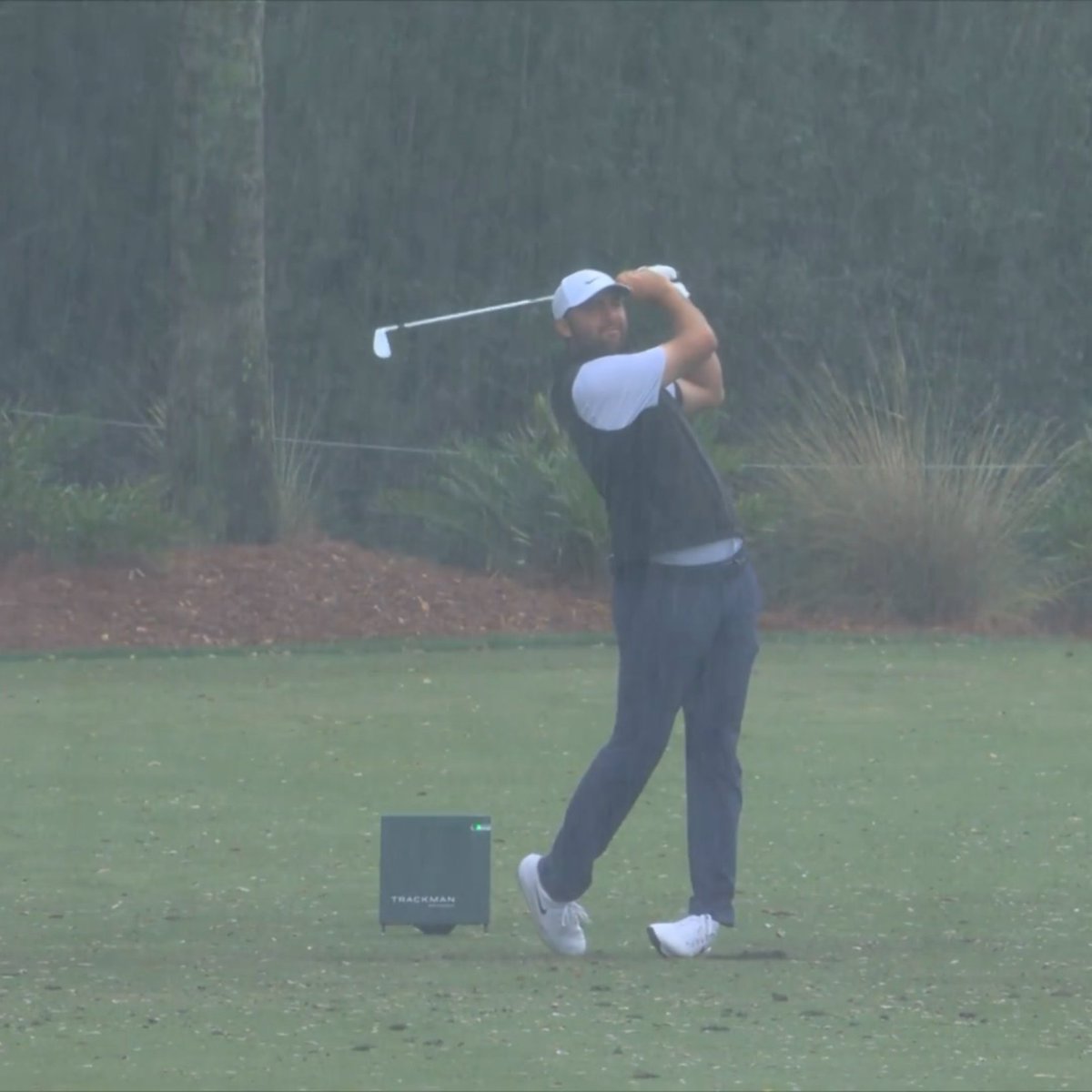 GOLF_com's tweet photo. A little rain isn't stopping Scottie Scheffler from grinding on the range. 😤 https://t.co/cU8Hc8mIw8