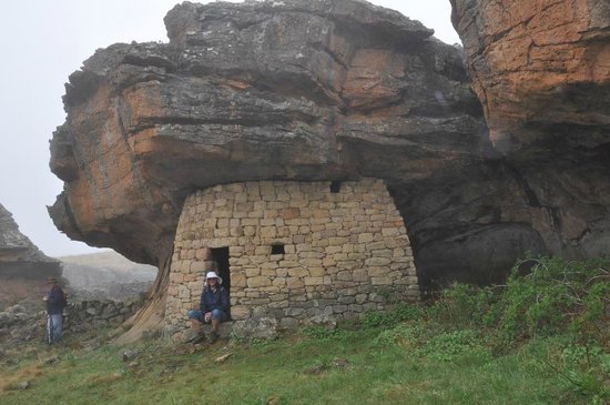 hallaboutafrica's tweet photo. AfricArchitecture. Rock dwelling in Lesotho. Just looking at this massive roof seeming to press down on the stone roundaval makes my head hurt. https://t.co/E3MIFAi3nF